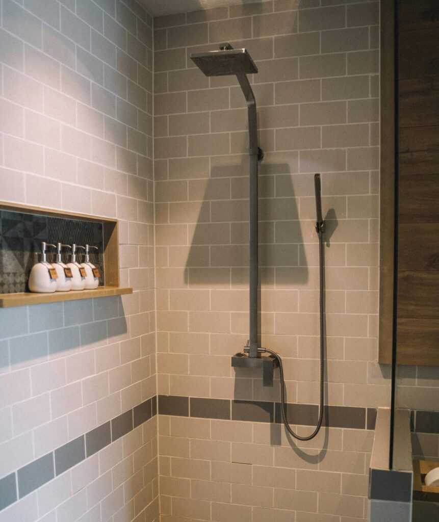 Our Amazon Travel Essentials Elegant bathroom interior with a sleek shower and tile design.
